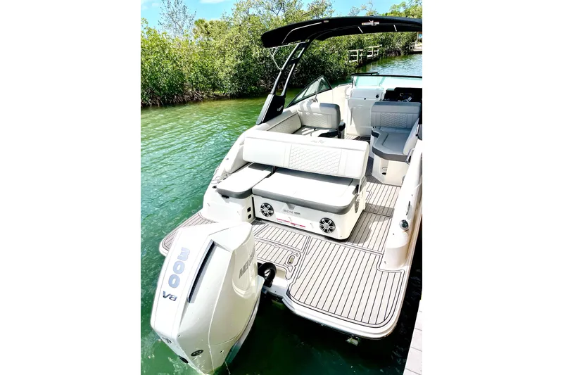 Slide: The Image of 2024 Sea Ray SDX 250 Outboard boat with spacious seating and sleek design on the water. - 5