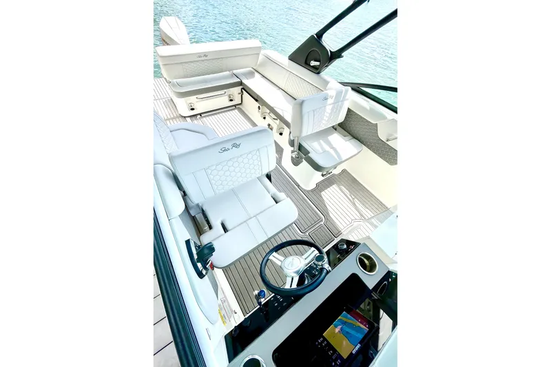 Slide: The Image of 2024 Sea Ray SDX 250 Outboard boat interior with luxurious seating and modern dashboard. - 7