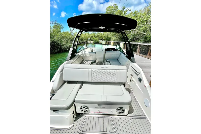 Slide: The Image of 2024 Sea Ray SDX 250 Outboard boat with spacious seating and sleek design on a sunny day. - 8