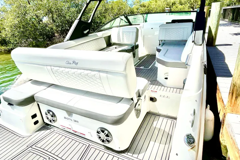 Slide: The Image of 2024 Sea Ray SDX 250 Outboard boat interior with luxurious seating and modern design. - 9
