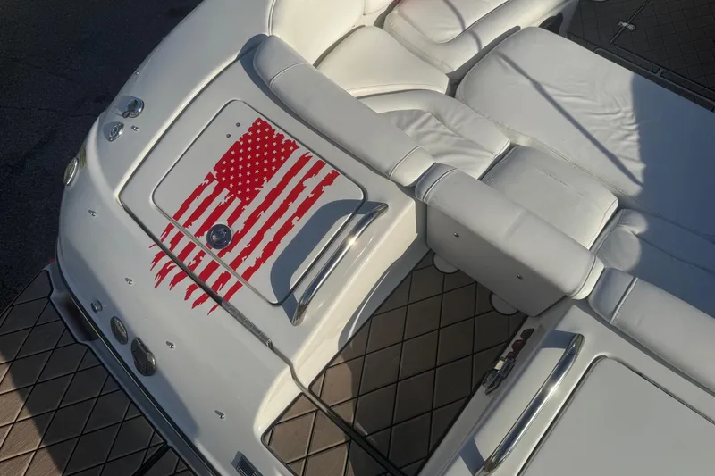 Slide: The Image of 2005 Crownline 270 BR boat interior with American flag design on white upholstery. - 15