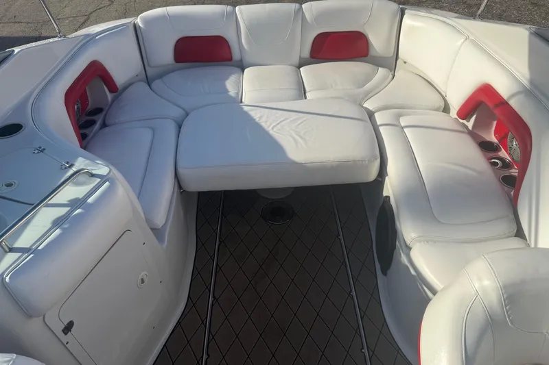 Slide: The Image of 2005 Crownline 270 BR boat interior with white and red seating arrangement. - 4