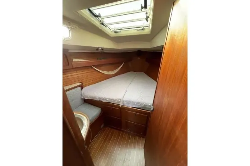Slide: The Image of Cozy cabin interior of 1990 Sabre 38 sailboat with wooden finish and skylight. - 14