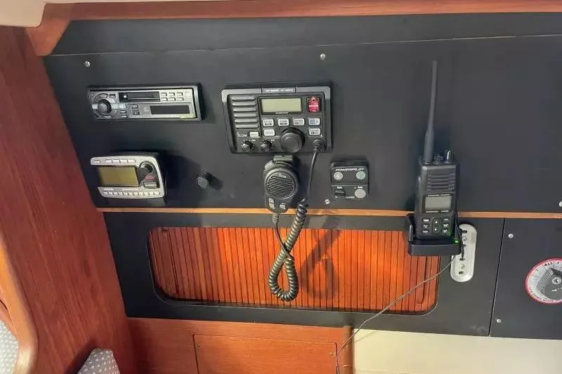 Slide: The Image of Control panel of a 1990 Sabre 38 sailboat with communication equipment. - 20