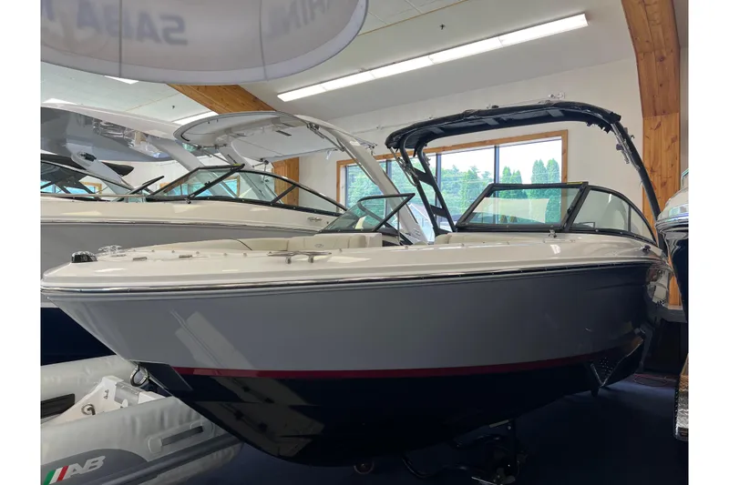 The Image of 2024 Regal LS2 boat displayed in a showroom, featuring sleek design and modern features. - 0