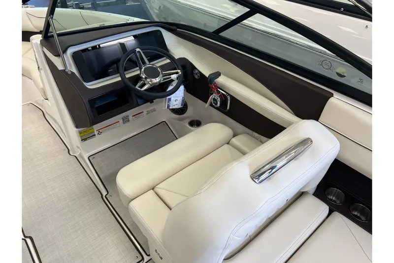 Slide: The Image of 2024 Regal LS2 boat interior with sleek steering wheel and luxurious seating. - 11