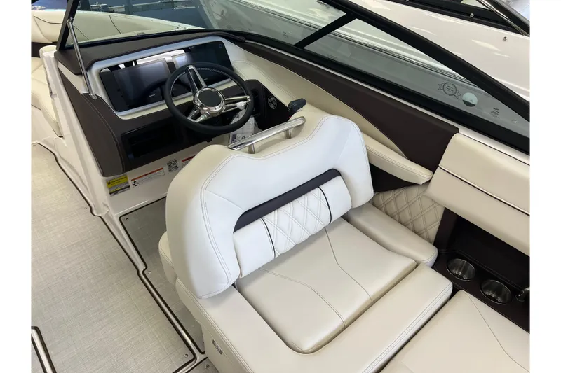 Slide: The Image of 2024 Regal LS2 boat interior with luxurious white seating and modern steering console. - 12
