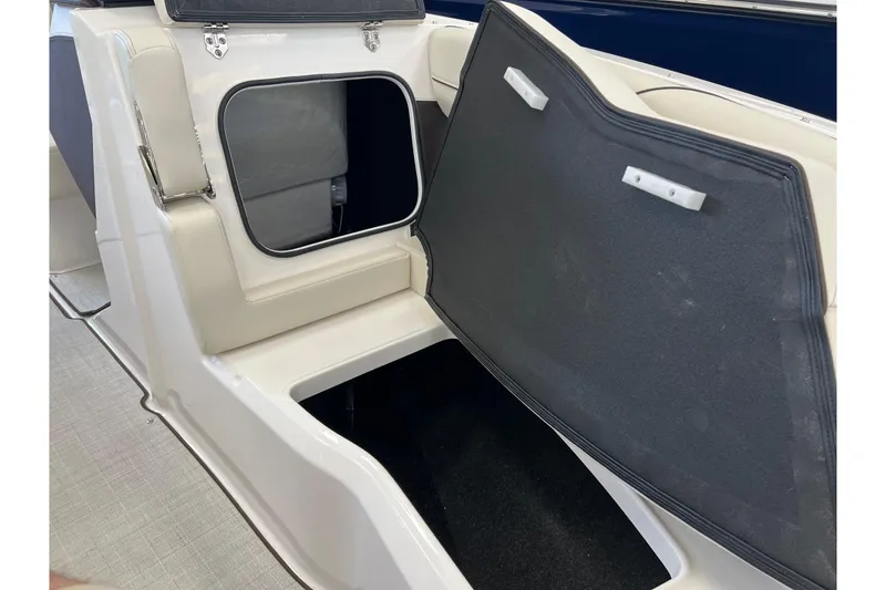 Slide: The Image of 2024 Regal LS2 boat storage compartment with open hatch, showcasing interior space. - 20