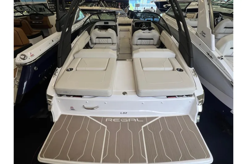 Slide: The Image of 2024 Regal LS2 boat interior with luxurious seating and sleek design. - 3