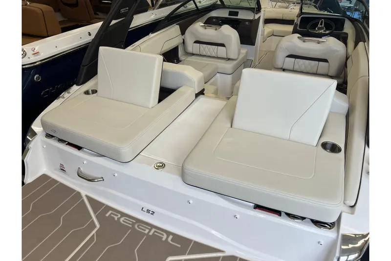 Slide: The Image of 2024 Regal LS2 boat interior with luxurious white seating and modern design. - 6