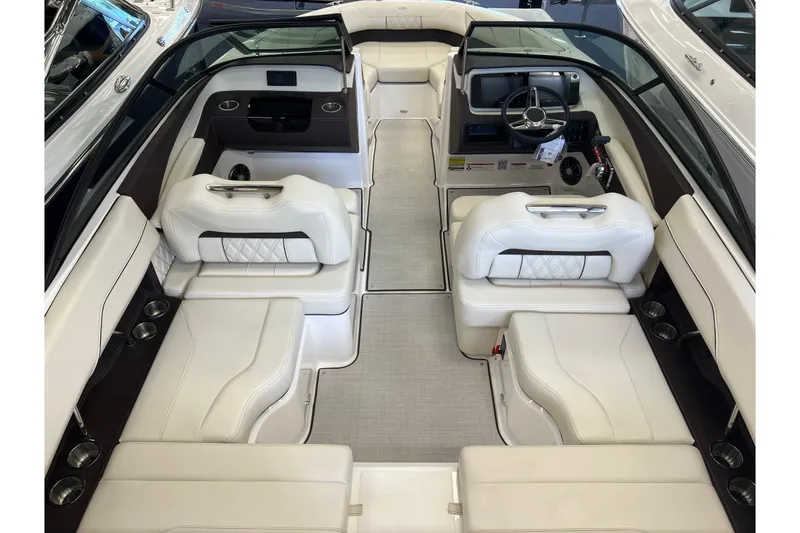 Slide: The Image of Luxurious interior of 2024 Regal LS2 boat with white seating and modern dashboard. - 7