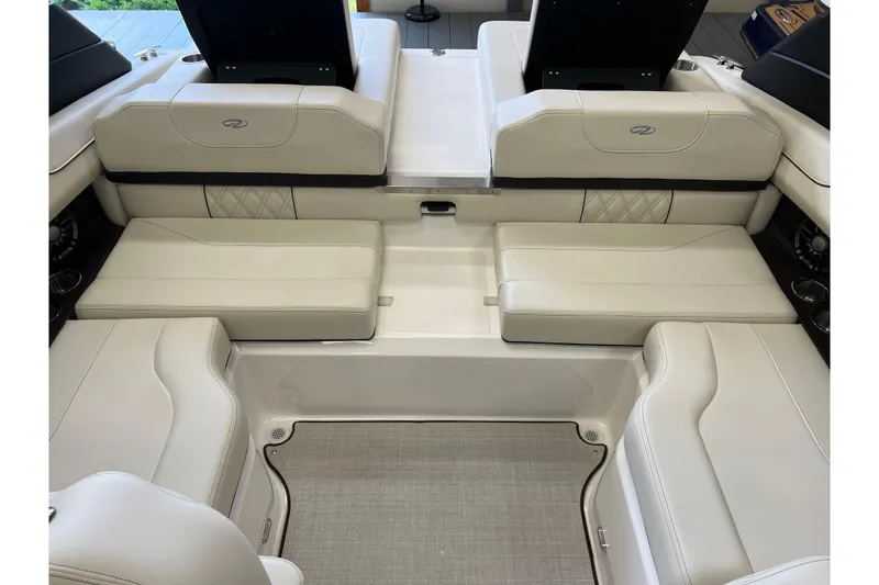 Slide: The Image of 2024 Regal LS2 boat interior with luxurious white seating and modern design. - 8