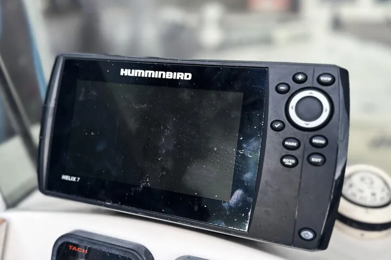 Slide: The Image of Humminbird Helix 7 fish finder on 2008 Hewes Redfisher 18 boat dashboard. - 5