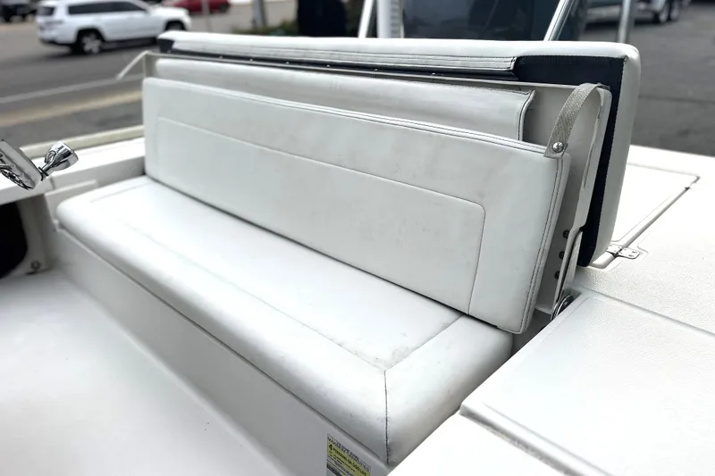 Slide: The Image of 2008 Hewes Redfisher 18 boat with white cushioned seating and sleek design. - 6