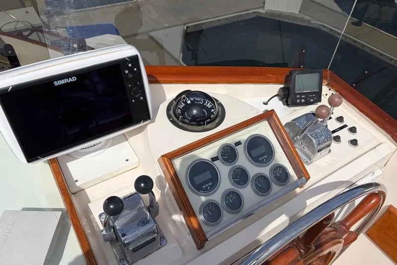 Slide: The Image of 1979 Grand Banks 42 Europa helm with navigation instruments and controls. - 11