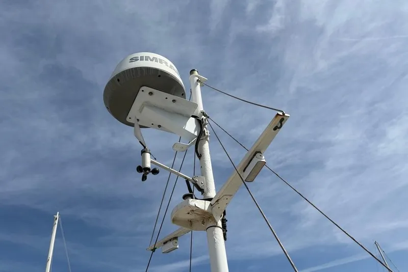 Slide: The Image of Radar equipment on a 1979 Grand Banks 42 Europa against a cloudy sky. - 15
