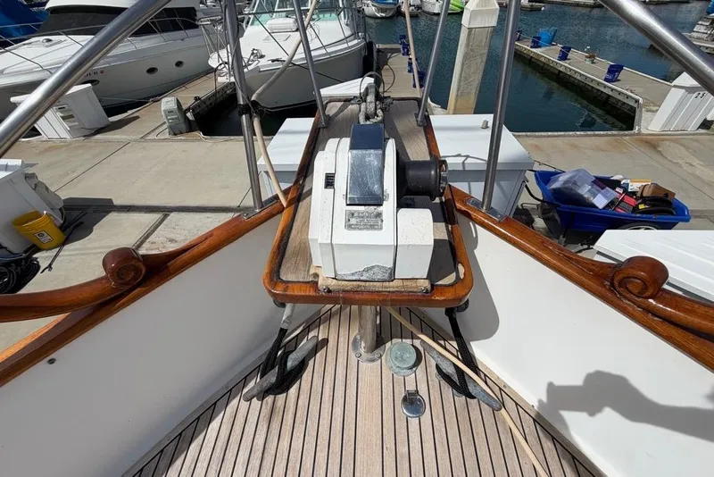 Slide: The Image of 1979 Grand Banks 42 Europa yacht deck with winch, docked at marina. - 16