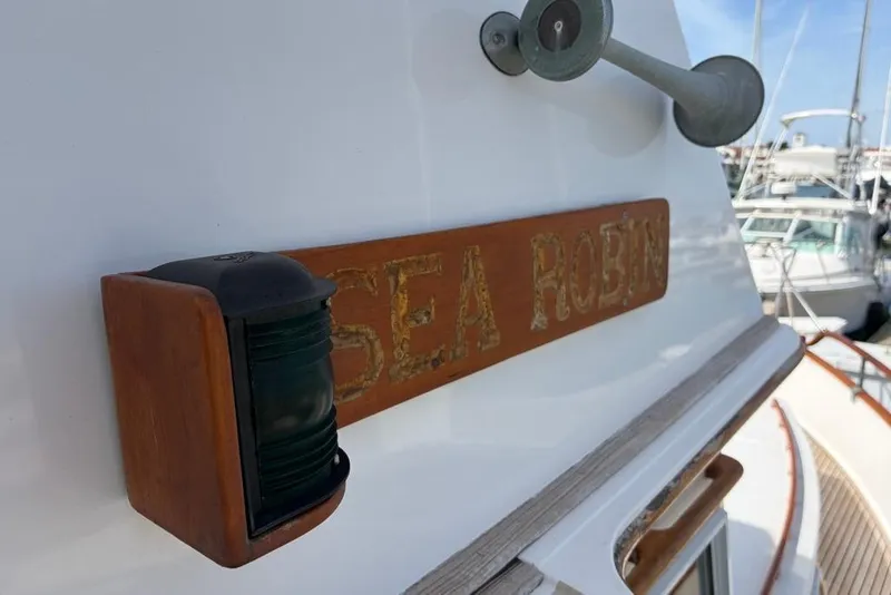 Slide: The Image of 1979 Grand Banks 42 Europa boat with "Sea Robin" nameplate and navigation light. - 22