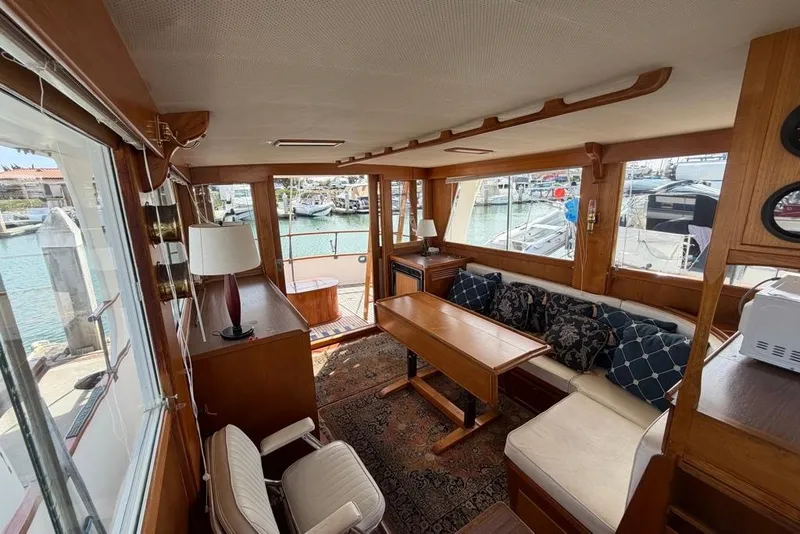 Slide: The Image of Interior of a 1979 Grand Banks 42 Europa yacht with elegant wood furnishings. - 25