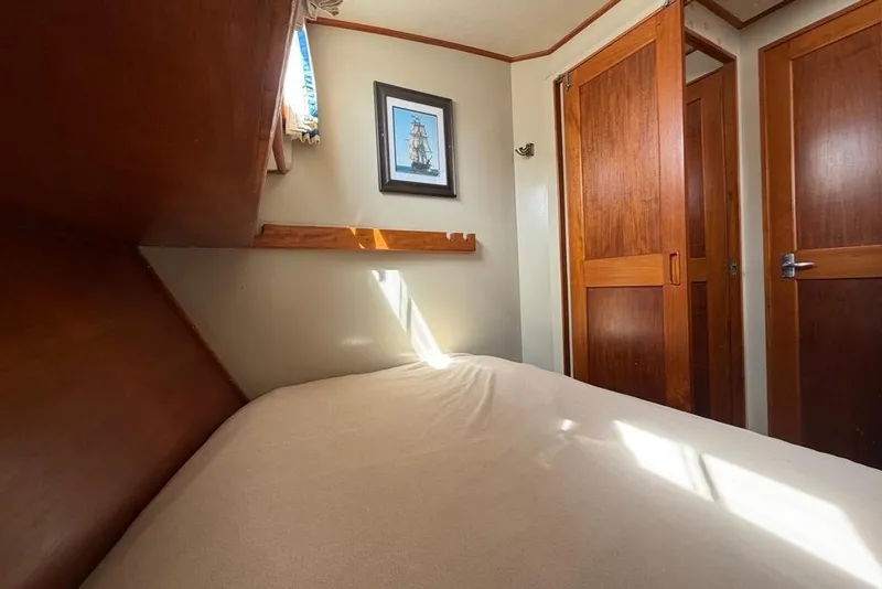 Slide: The Image of Cozy cabin interior of 1979 Grand Banks 42 Europa with wooden doors and nautical decor. - 45