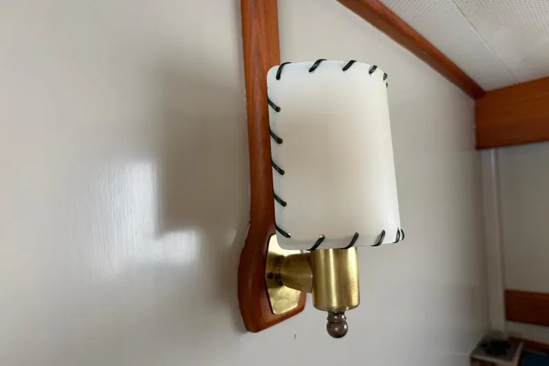 Slide: The Image of Vintage brass wall sconce with stitched shade on 1979 Grand Banks 42 Europa yacht. - 48