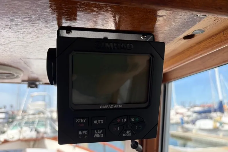 Slide: The Image of Simrad AP16 autopilot on 1979 Grand Banks 42 Europa yacht, docked at marina. - 51