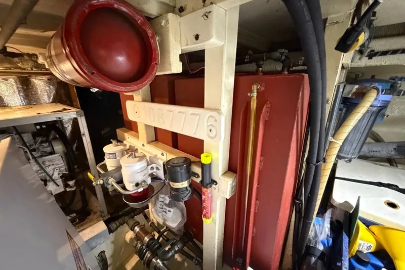 Slide: The Image of Engine room of 1979 Grand Banks 42 Europa, showcasing mechanical components and equipment. - 55