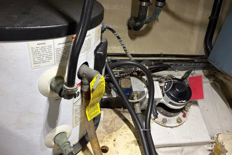 Slide: The Image of Engine room of a 1979 Grand Banks 42 Europa with visible wiring and components. - 56