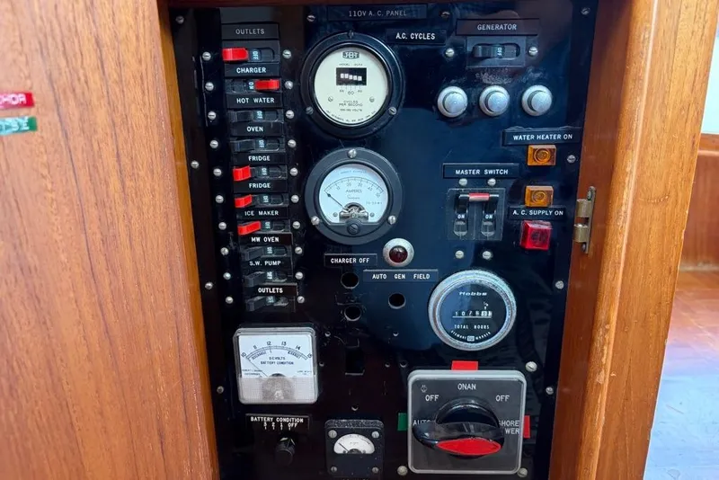 Slide: The Image of Electrical control panel on a 1979 Grand Banks 42 Europa boat. - 59