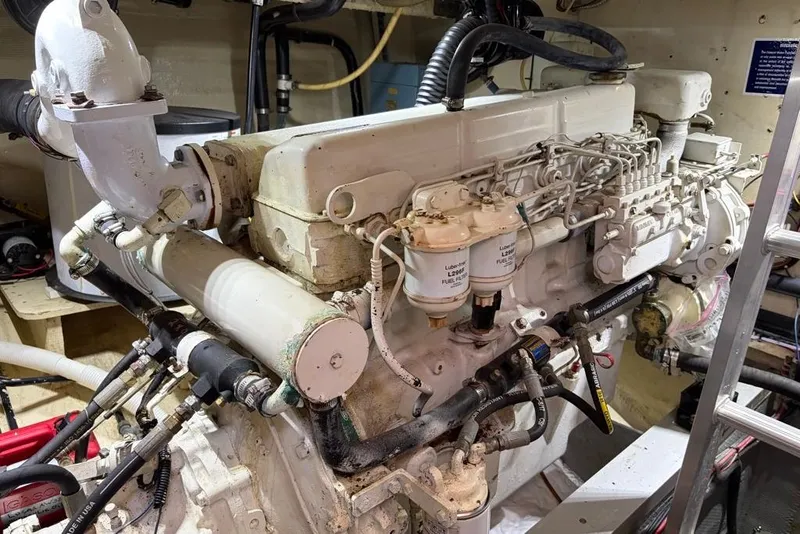 Slide: The Image of Engine room of a 1979 Grand Banks 42 Europa, showcasing detailed mechanical components. - 60