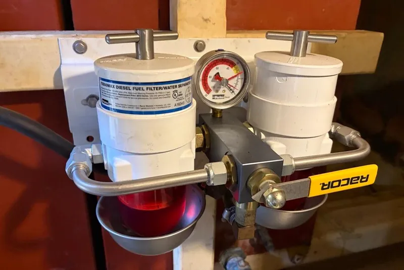 Slide: The Image of Dual diesel fuel filters with pressure gauge on a 1979 Grand Banks 42 Europa. - 61