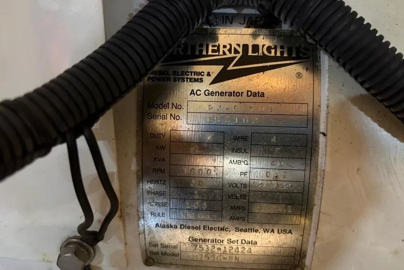 Slide: The Image of Close-up of Northern Lights AC generator data plate on a 1979 Grand Banks 42 Europa. - 64