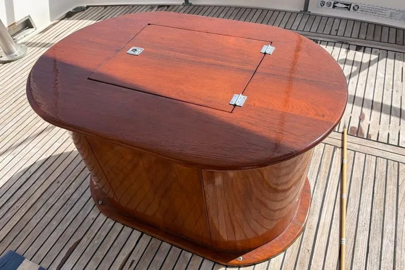 Slide: The Image of Wooden table on 1979 Grand Banks 42 Europa yacht deck. - 7