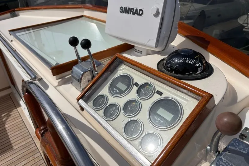 Slide: The Image of Helm of 1979 Grand Banks 42 Europa with navigation instruments and controls. - 9