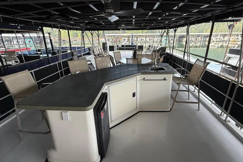 Slide: The Image of Spacious deck of a 1998 Sumerset 16x76 houseboat with seating and bar area. - 15