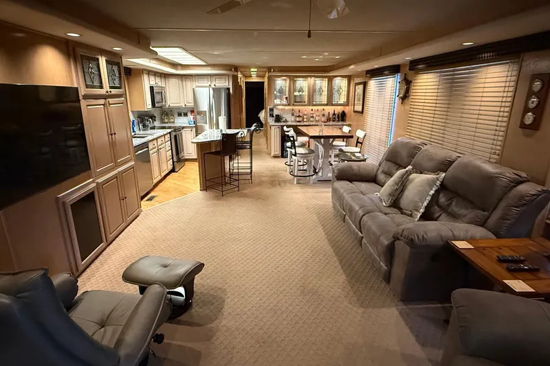 Slide: The Image of Luxurious 1998 Sumerset 16x76 houseboat interior with modern kitchen and cozy living area. - 3