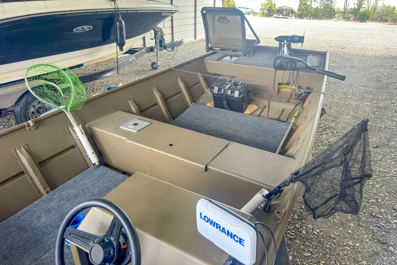 Slide: The Image of 2022 G3 1648 LW boat with fishing gear and Lowrance equipment in a storage area. - 10
