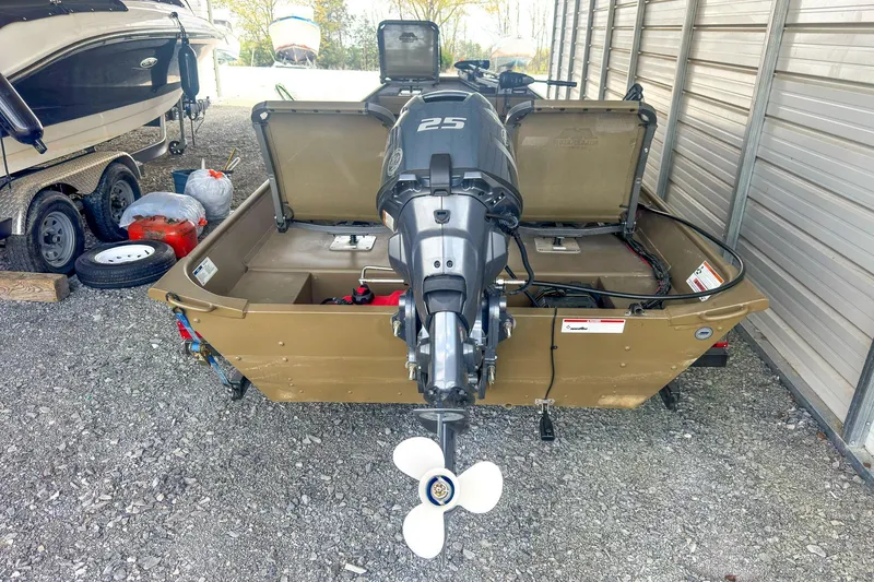 Slide: The Image of 2022 G3 1648 LW boat with 25 HP outboard motor in storage. - 12