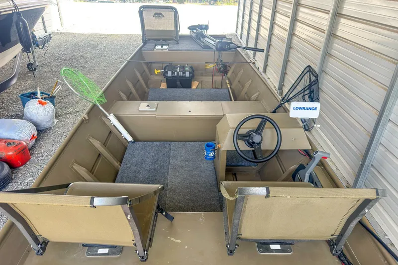 Slide: The Image of 2022 G3 1648 LW boat interior with fishing gear and Lowrance equipment. - 14