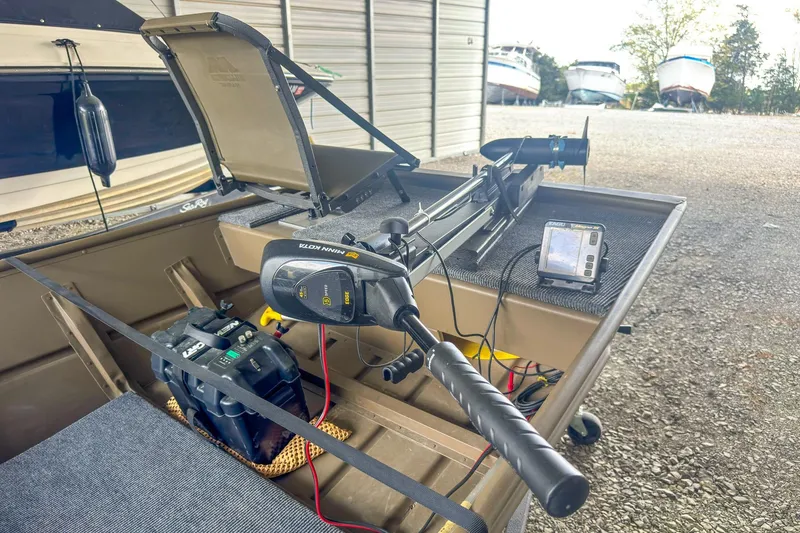 Slide: The Image of 2022 G3 1648 LW boat with trolling motor and fish finder in storage area. - 16