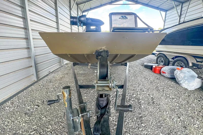 Slide: The Image of 2022 G3 1648 LW boat on trailer in covered storage area. - 6