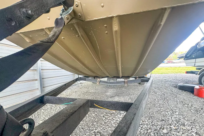 Slide: The Image of 2022 G3 1648 LW boat on trailer, showing hull and trailer details. - 7