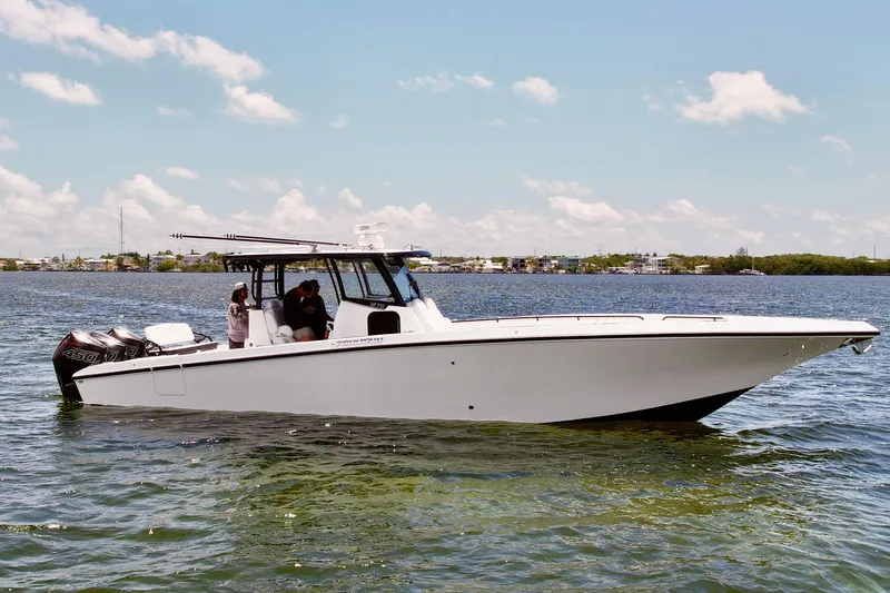 The Image of 2023 Fountain 38 Tournament Edition boat on calm water under a clear sky. - 1