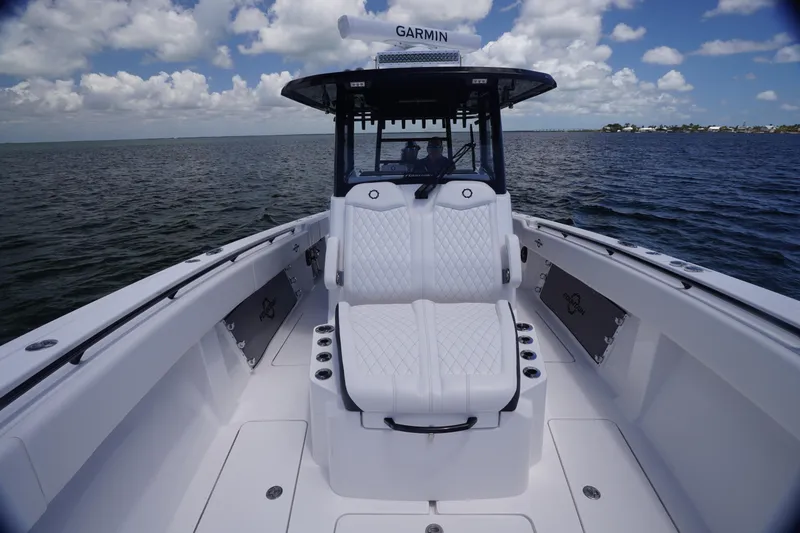 Slide: The Image of 2023 Fountain 38 Tournament Edition boat on open water, featuring luxurious seating and Garmin equipment. - 10