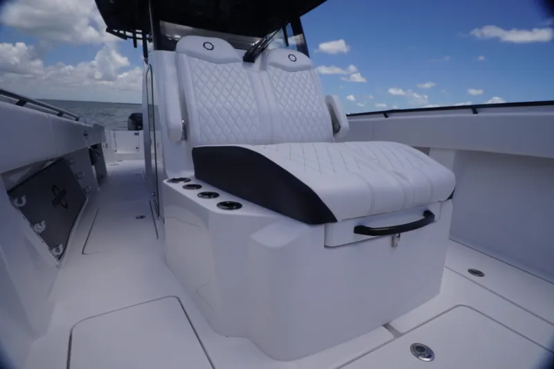 Slide: The Image of 2023 Fountain 38 Tournament Edition boat interior with luxurious seating and ocean backdrop. - 13