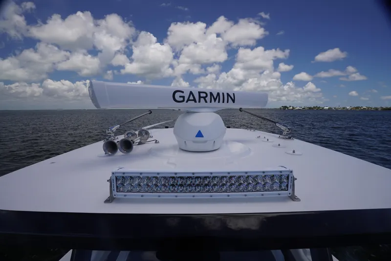 Slide: The Image of 2023 Fountain 38 Tournament Edition boat with Garmin radar on open water. - 15
