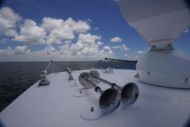 Slide: The Image of 2023 Fountain 38 Tournament Edition boat on open water under blue sky with clouds. - 16