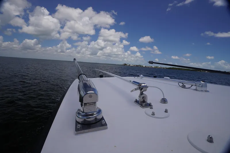 Slide: The Image of Bow view of 2023 Fountain 38 Tournament Edition boat on open water under cloudy sky. - 17