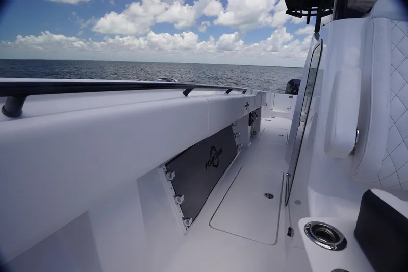 Slide: The Image of 2023 Fountain 38 Tournament Edition boat interior with ocean view and clear sky. - 19