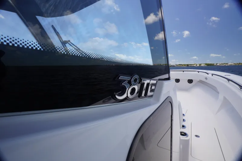 Slide: The Image of 2023 Fountain 38 Tournament Edition boat on water, showcasing sleek design and logo. - 22